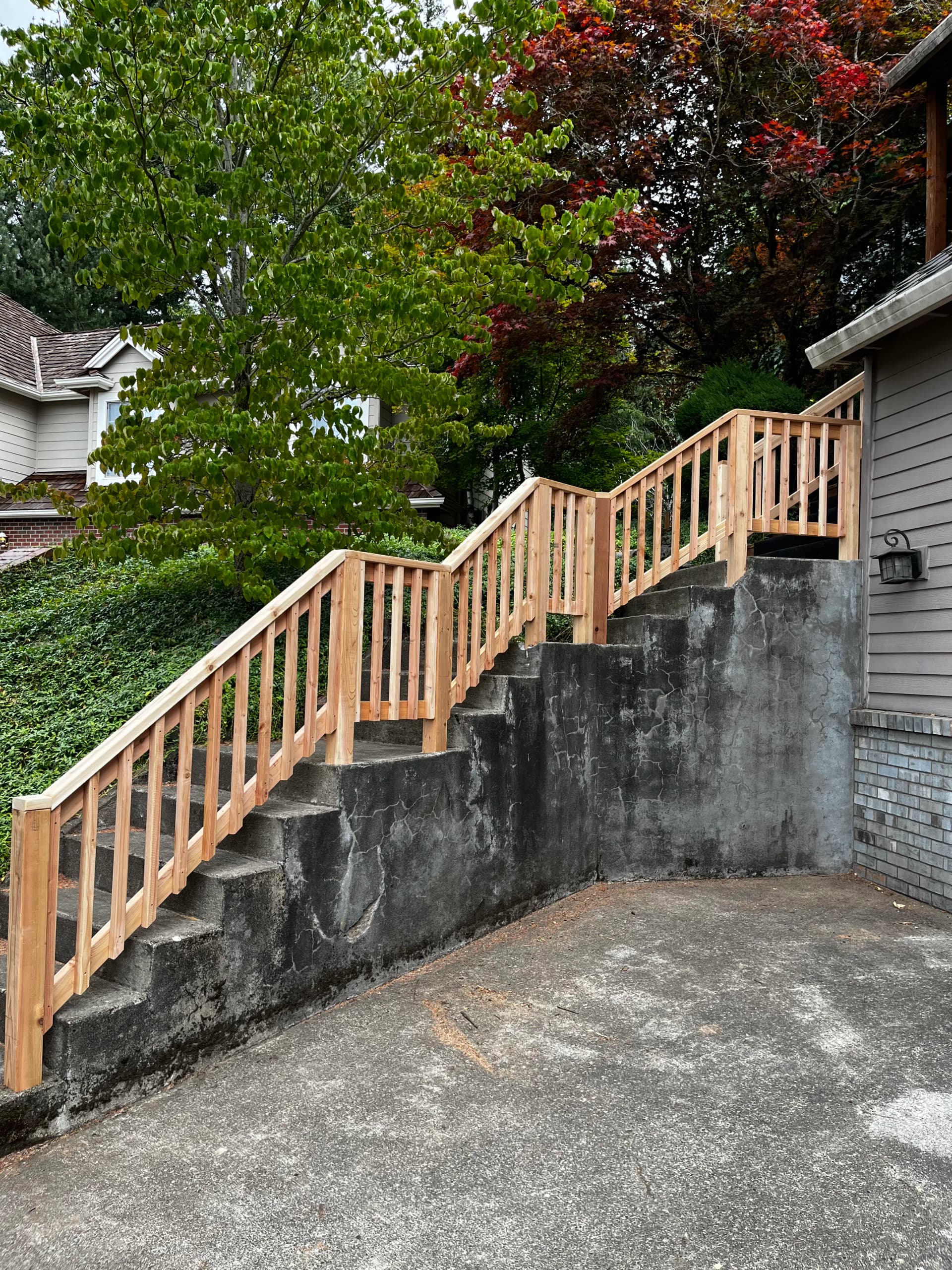 Gallery photos for Custom Cedar Railing Built for Concrete Entryway Steps: Image #1