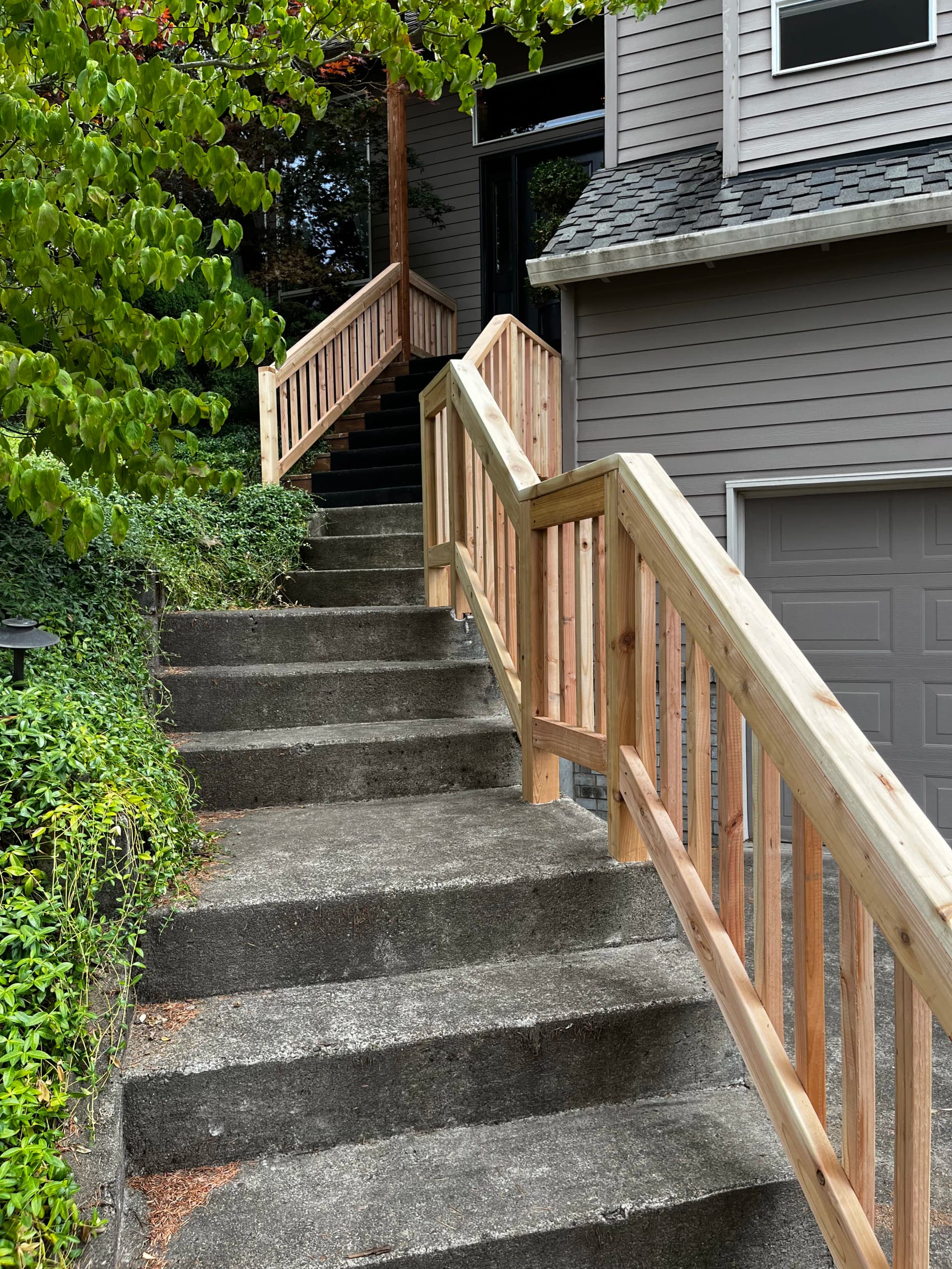 Custom Cedar Railing Built for Concrete Entryway Steps image