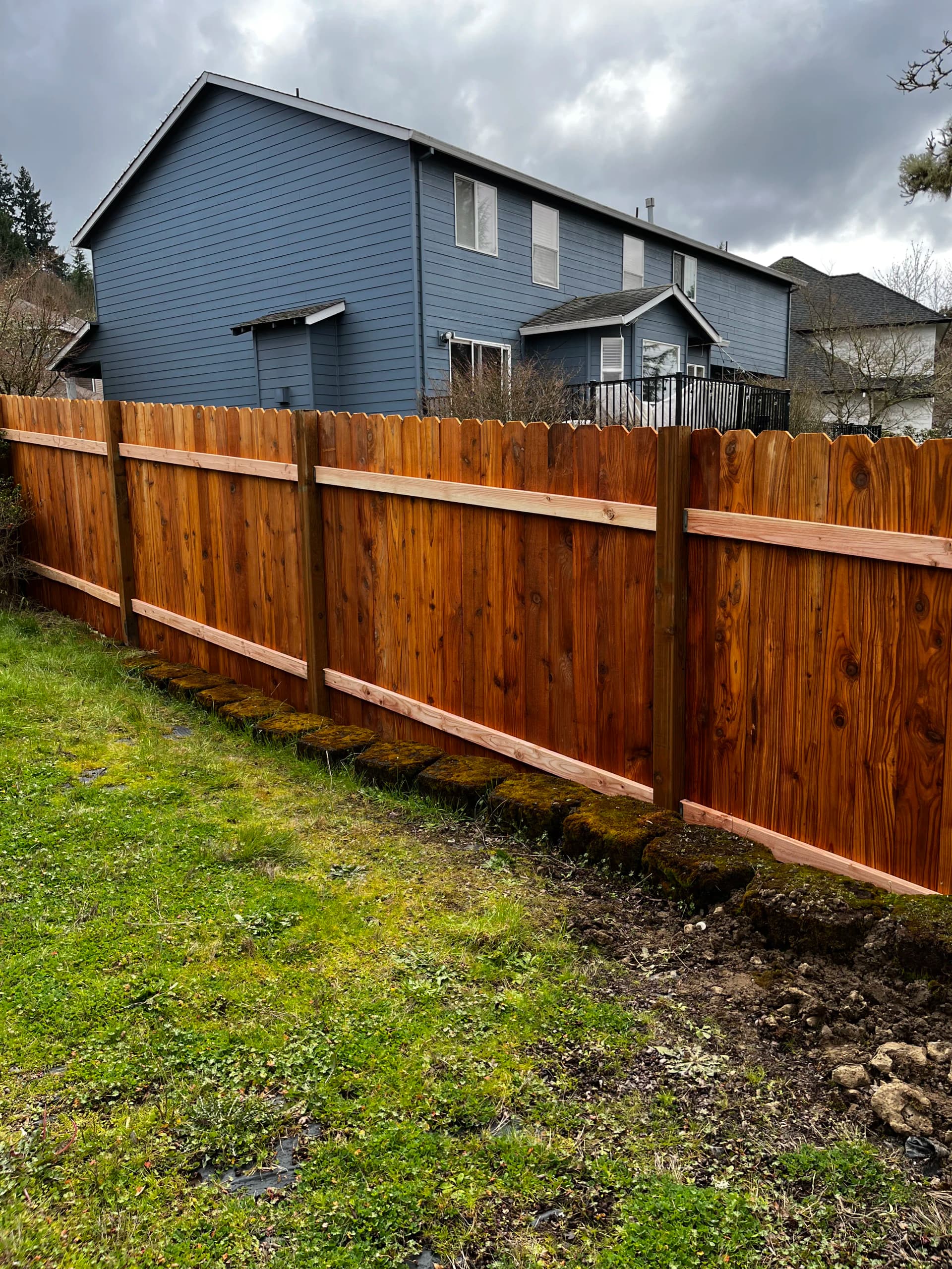 Contoured Dog Ear Cedar Fence Built for Uneven Ground image
